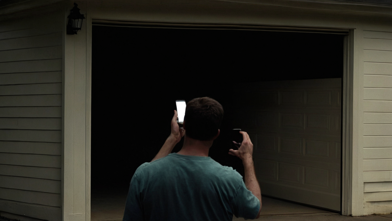 Blank phone access review beside garage